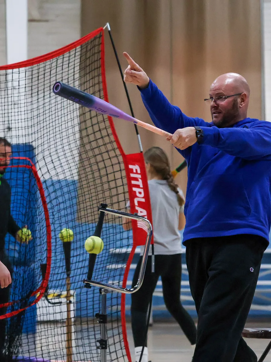 Kevin Staggs coaching a hitter at Staggs Performance Lab