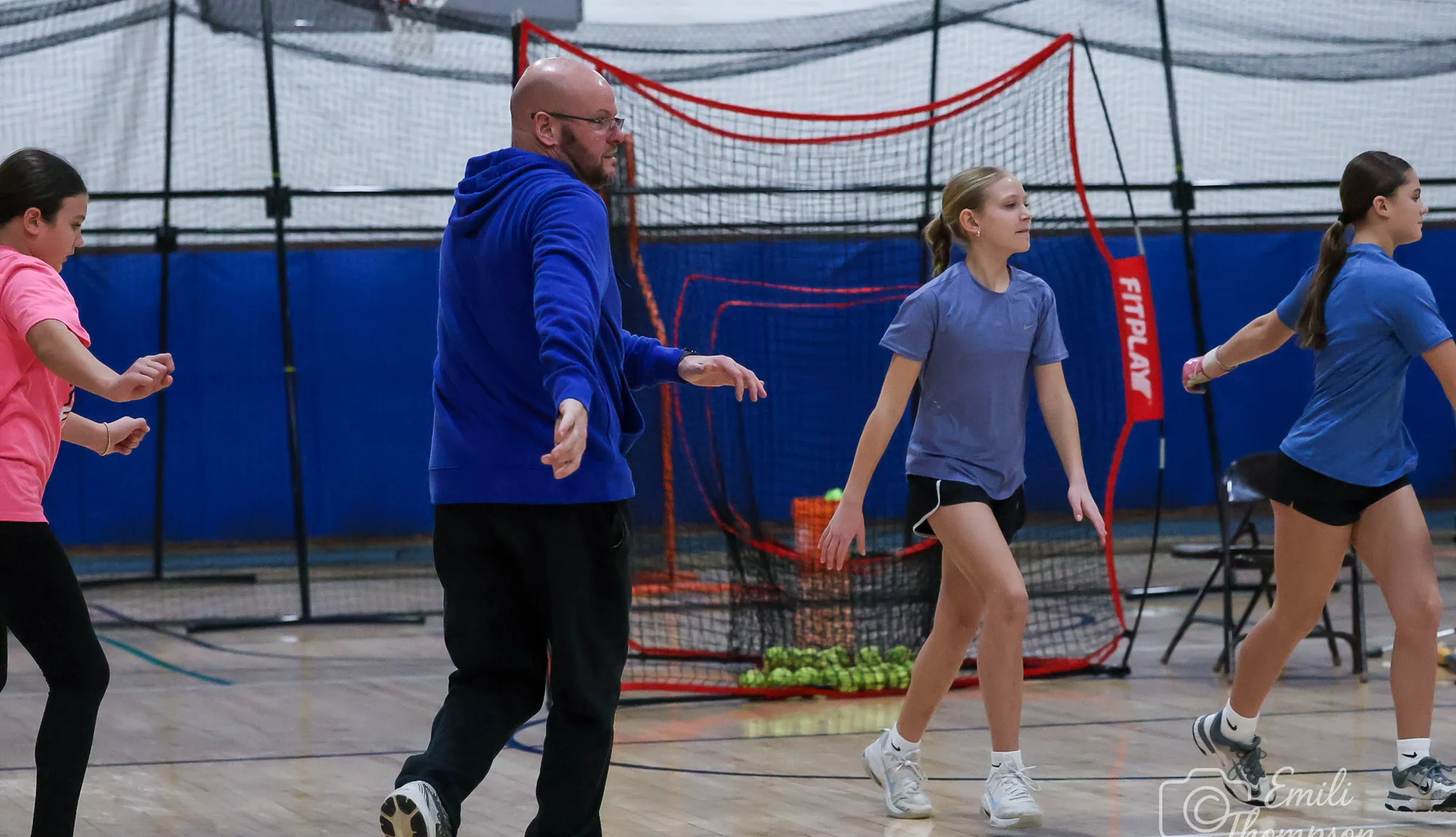 Athletes working through a training session with a coach
